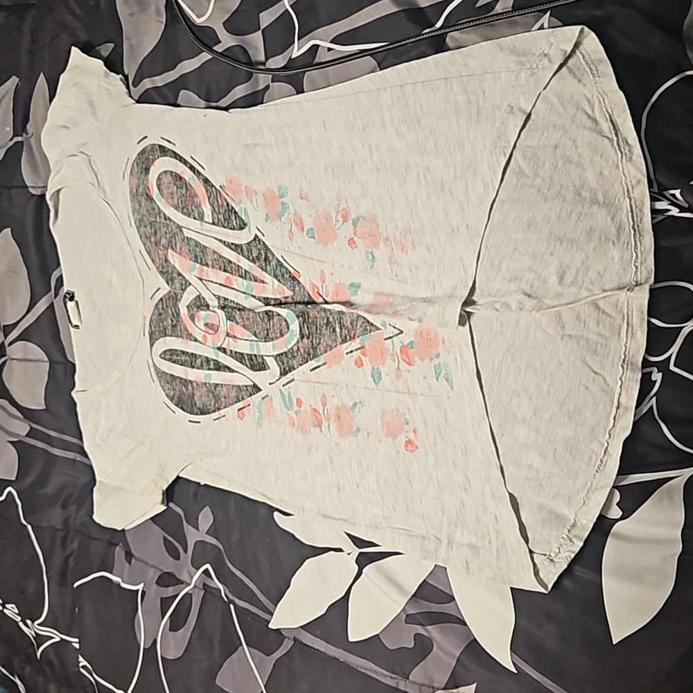 A V-neck Wet Seal T-shirt.